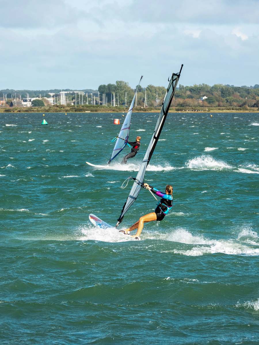 leisure activities woman sailing surfboard sea